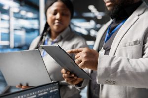 Reviewing regulatory data on a tablet and laptop