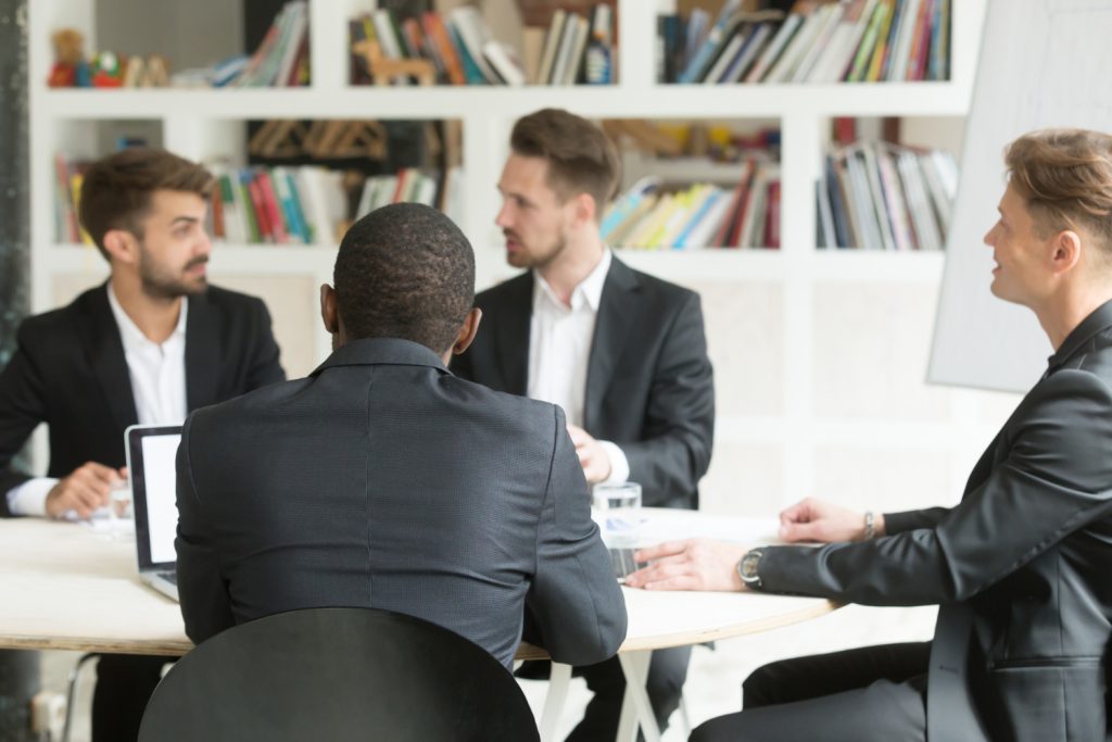 Business meeting around a conference table